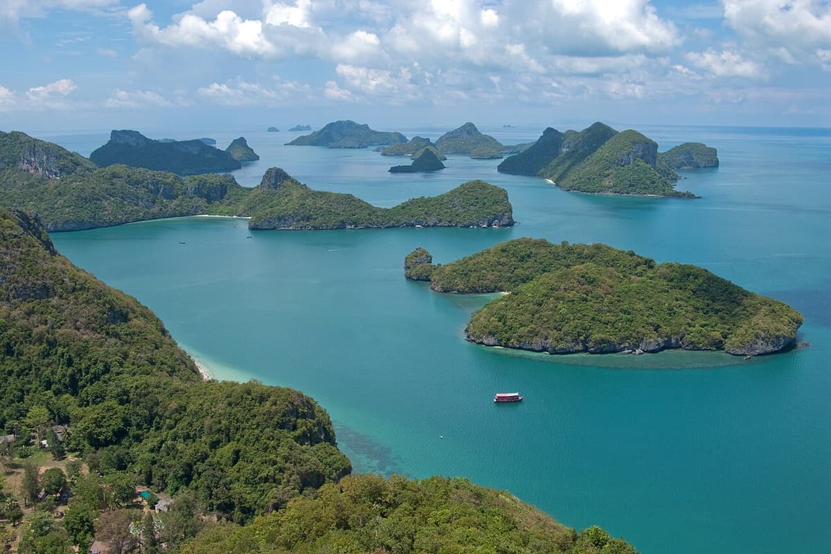 Green limestone islands scattered across the sea in Ang Thong National Marine Park