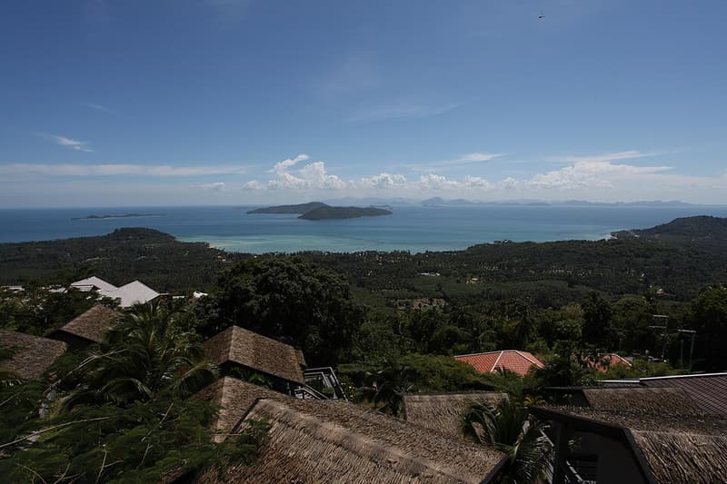 View over palm-covered hills and the sea from high ground on Koh Samui