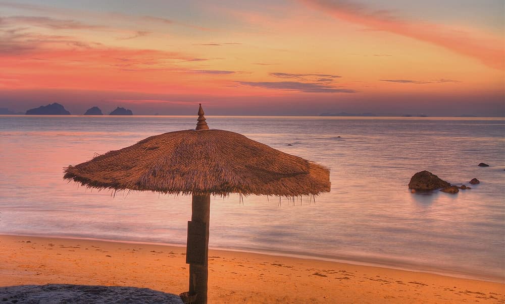 An orange sunset over a beach on Koh Samui